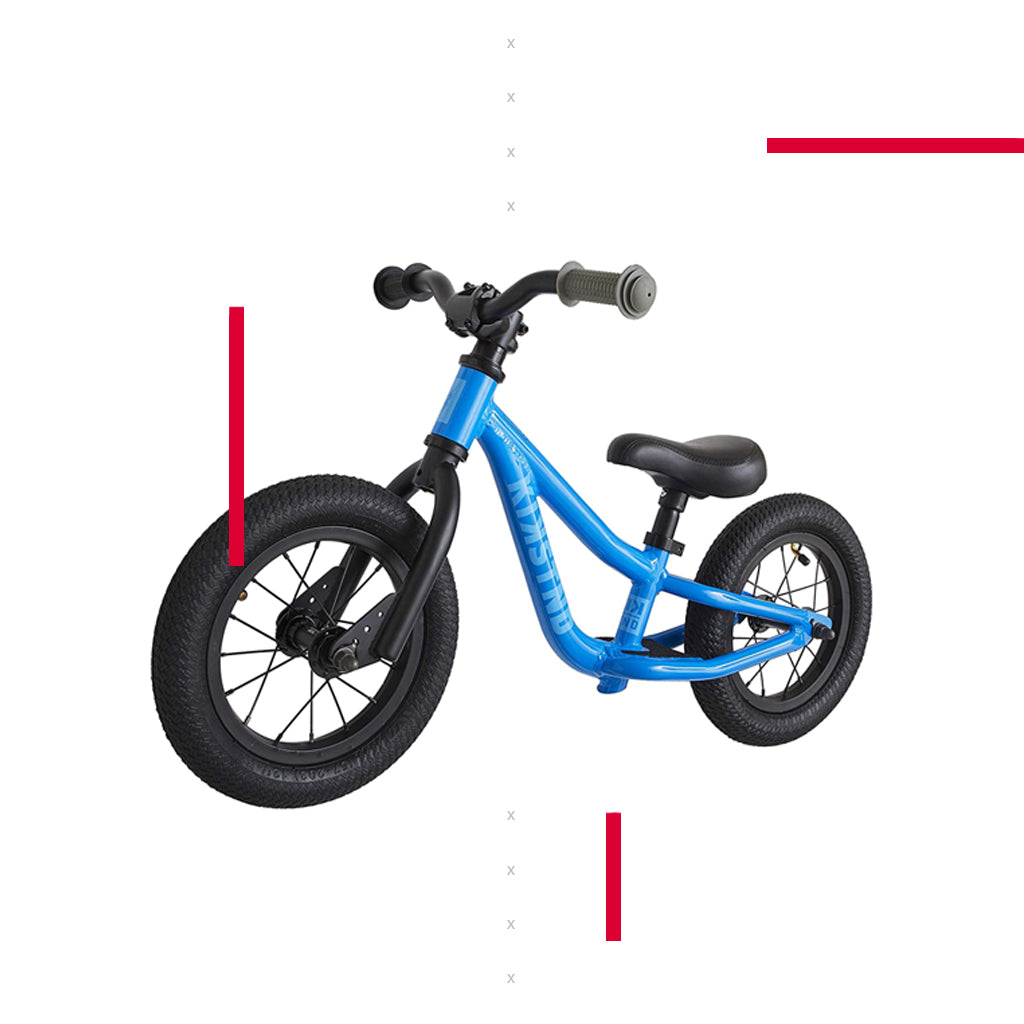 blue balance bike for kids on white background with red lines for design effect