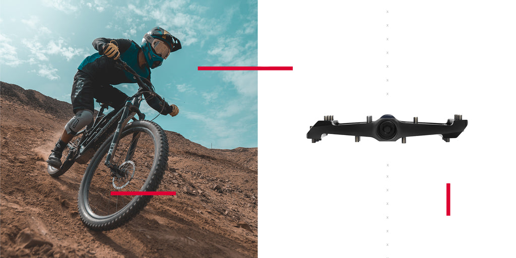 mountain biker riding downhill with performance bike pedals