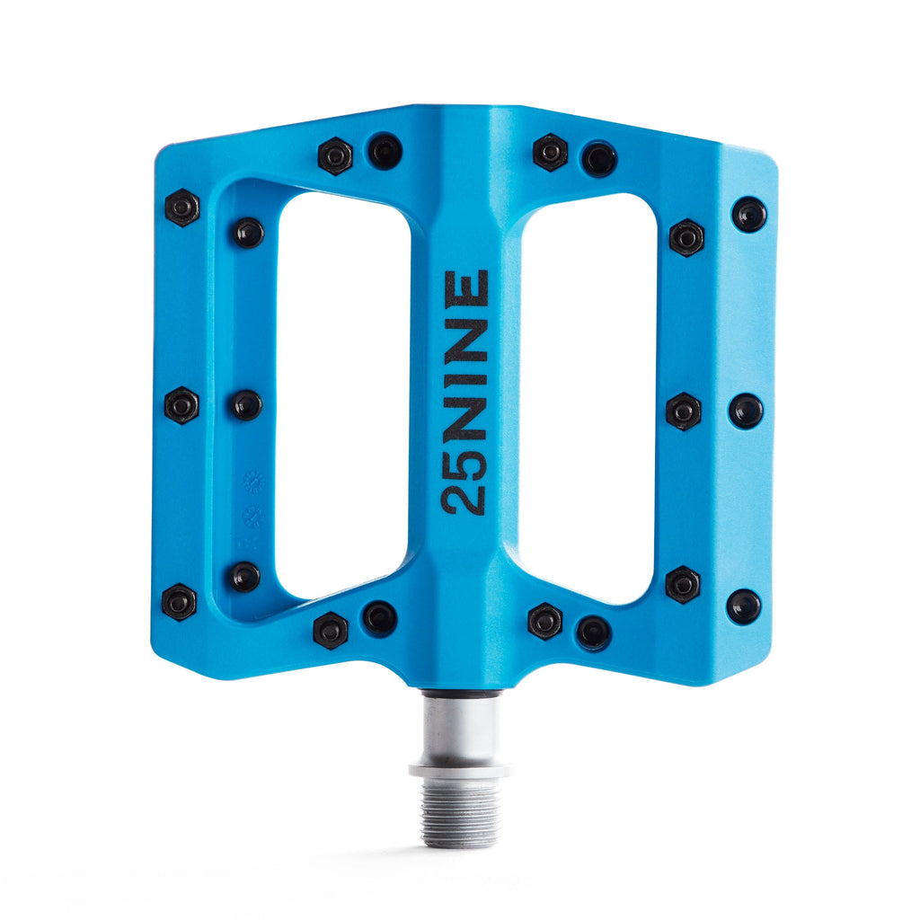 High traction bike pedal with removable pins. Blue pedal from a top view on a white background.