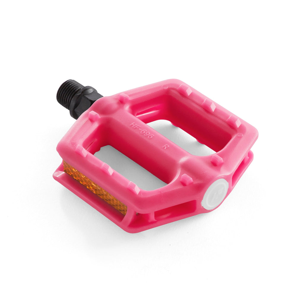 one bright pink bicycle pedal for youth corner view with white background