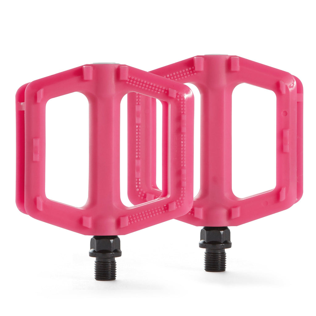 Two pink bicycle pedals for kids. Top view with a white background.
