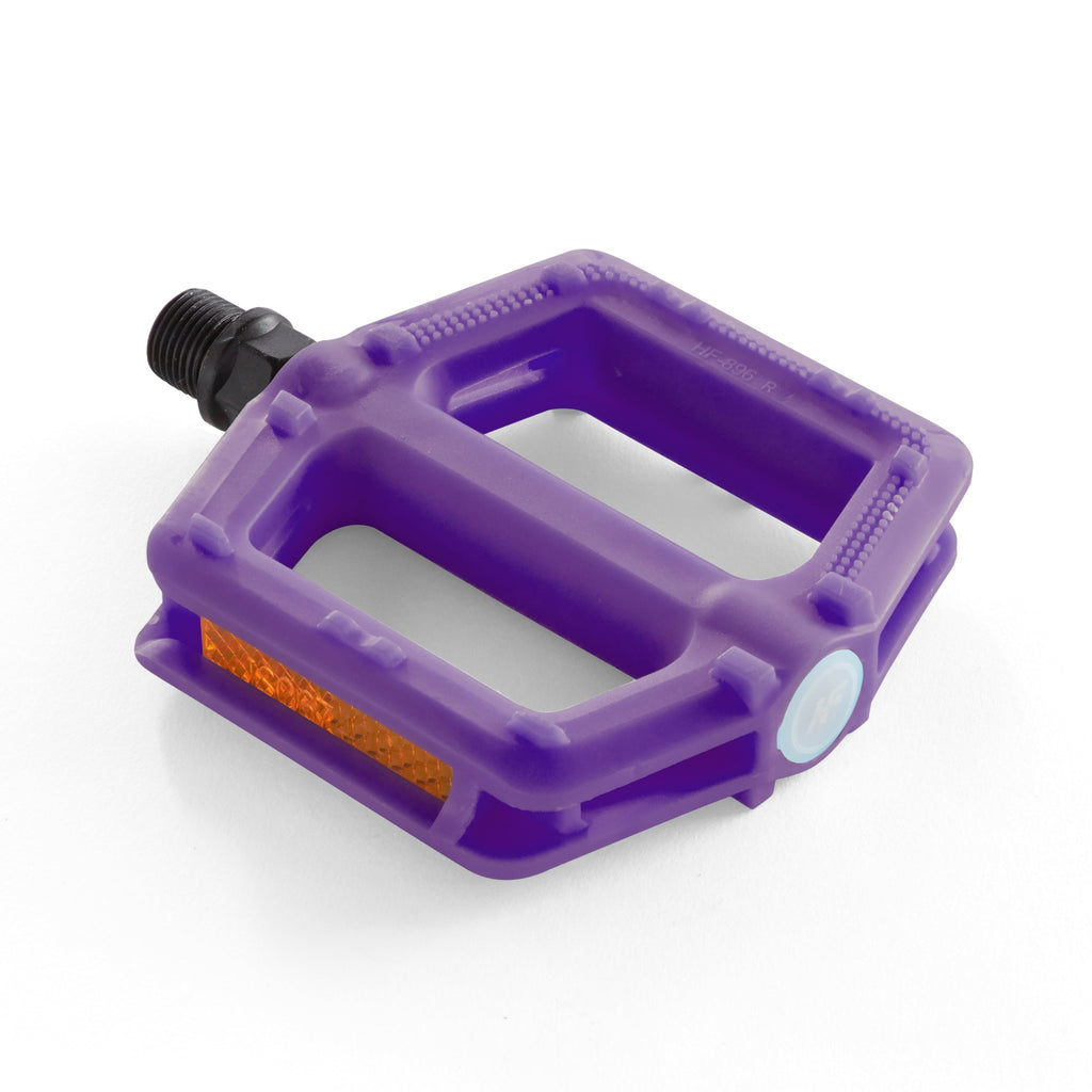A purple bike pedal for kids. Corner overhead view with a white background. 