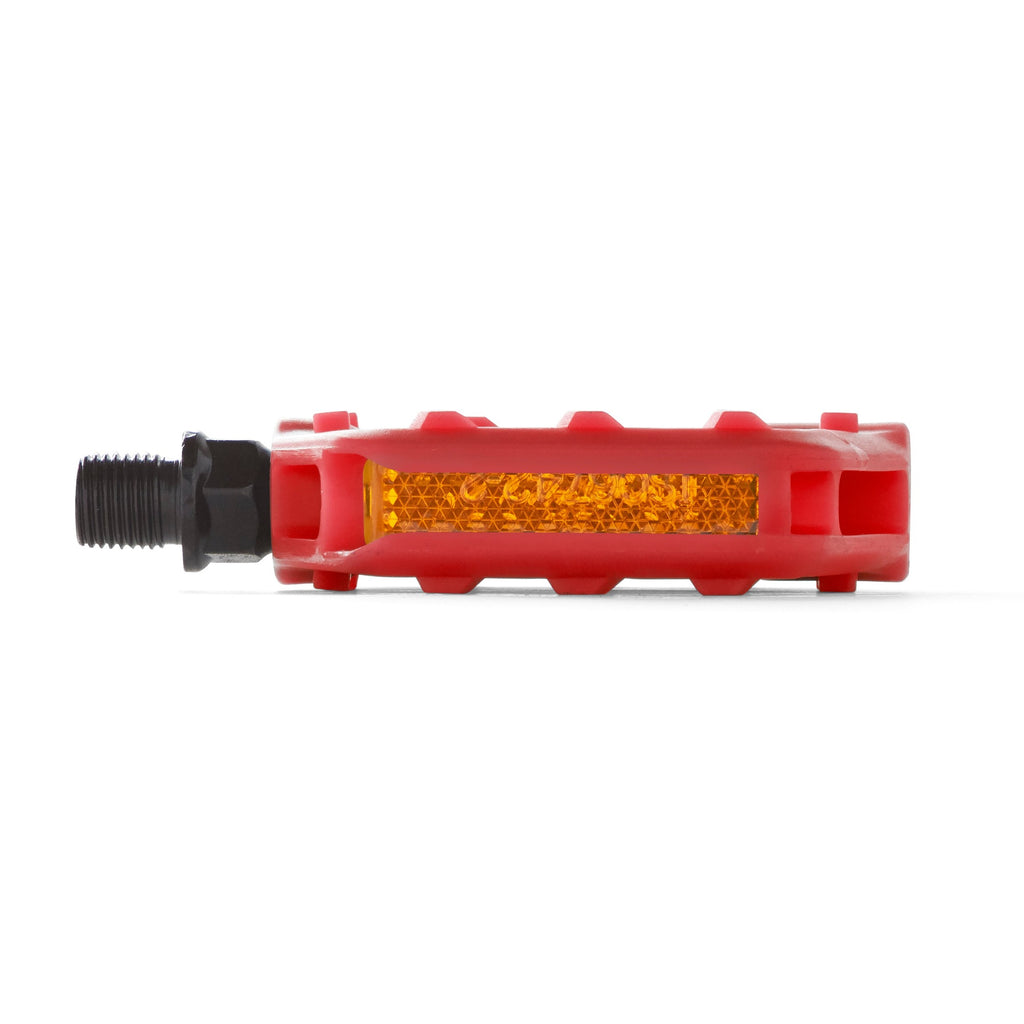 Kids bike pedal with safety reflector in the color red. Side view with white background.