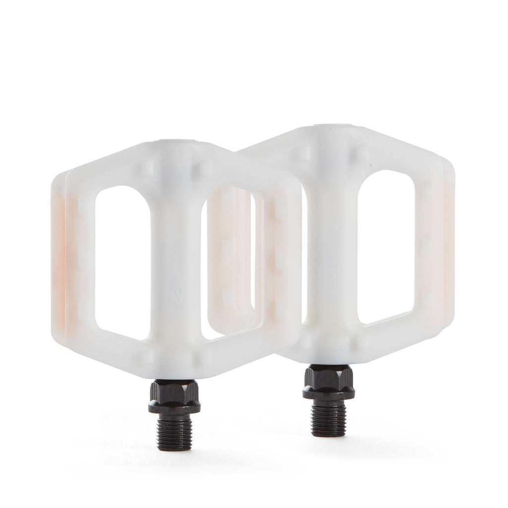 White bike pedals for kids. Top down view with white background.