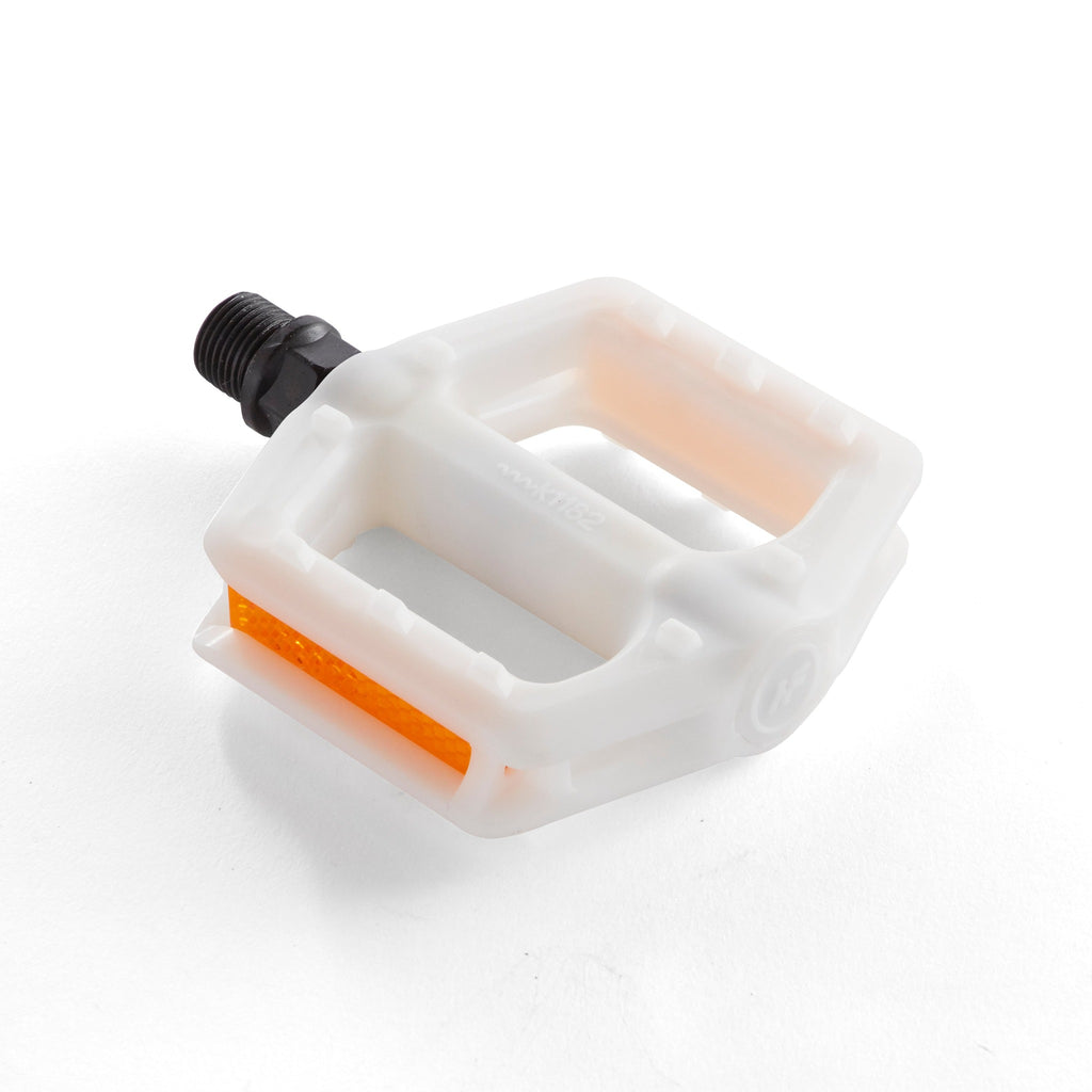 White bike pedal for kids. Angled down view with white background.
