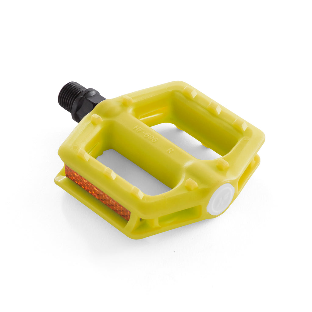 Yellow bike pedal for kids. Angled down view with white background.