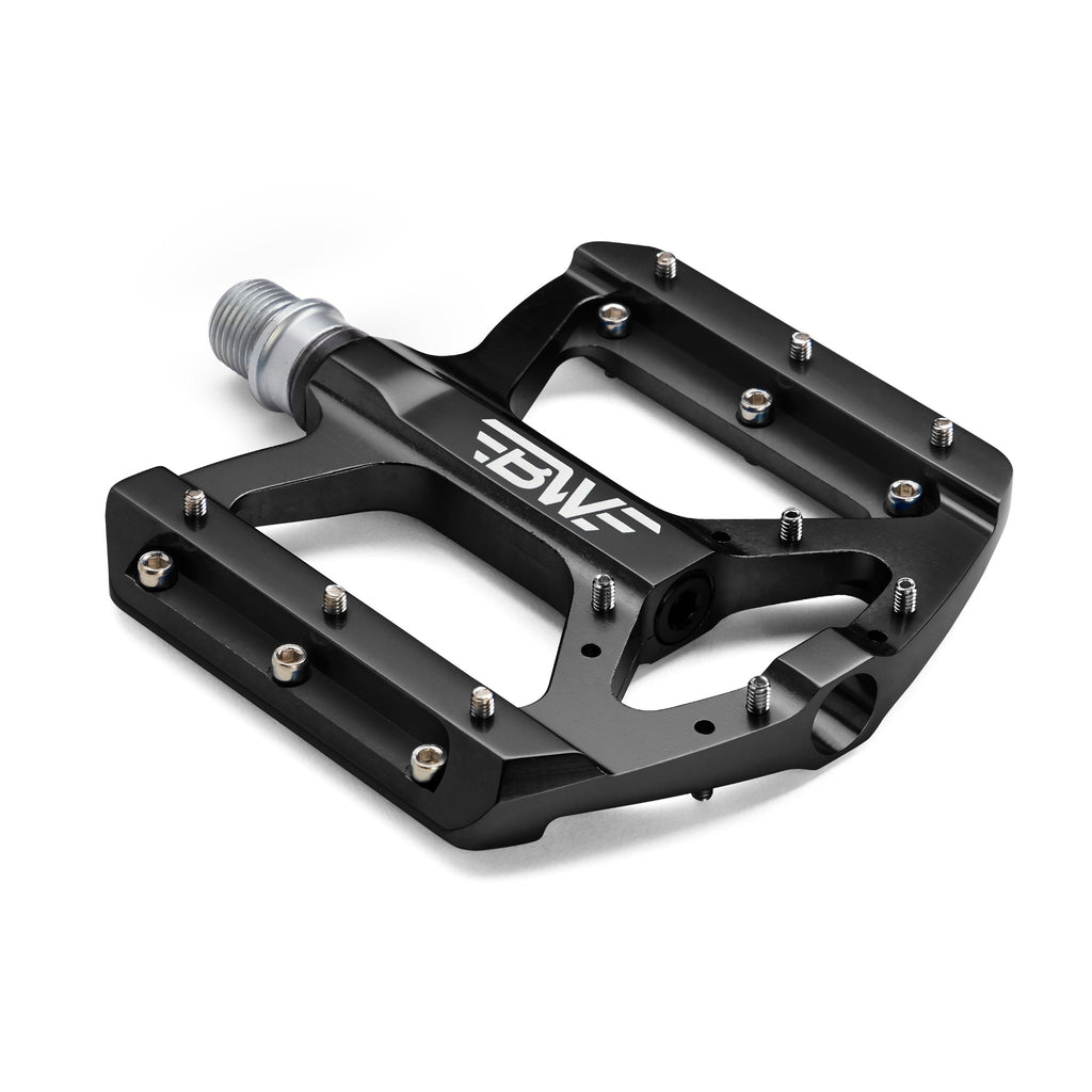 Black mountain bike pedal on white background. Corner view of mountain bike pedal.