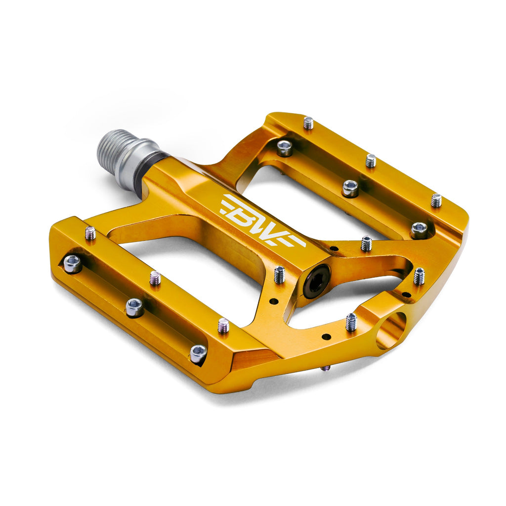 Gold mountain bike pedal on white background. Corner view of mountain bike pedal.