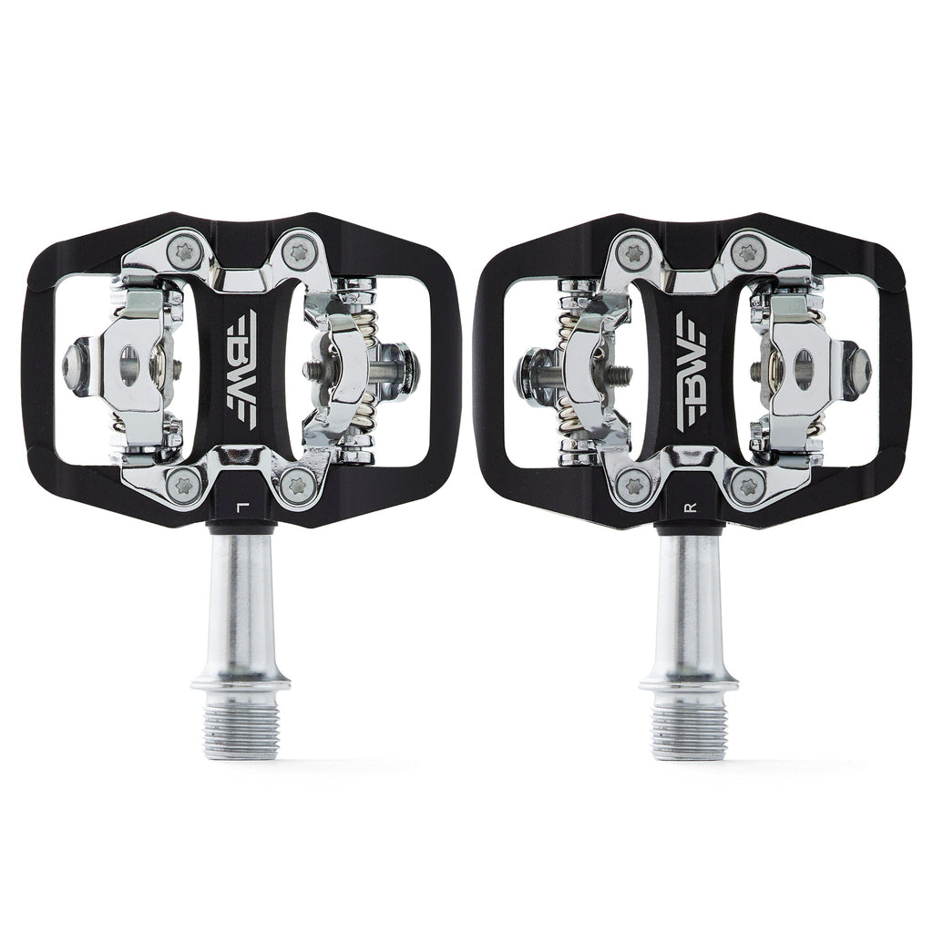Black clipless mountain bike pedals, top view on white background. SPD compatible bicycle pedals.