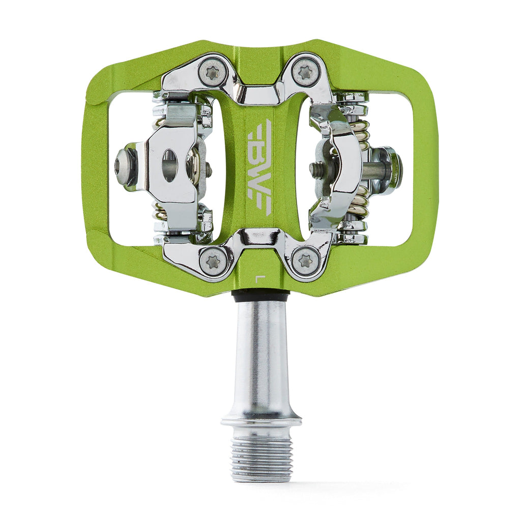Green clipless mountain bike pedal, top view on white background. SPD compatible bicycle pedal.