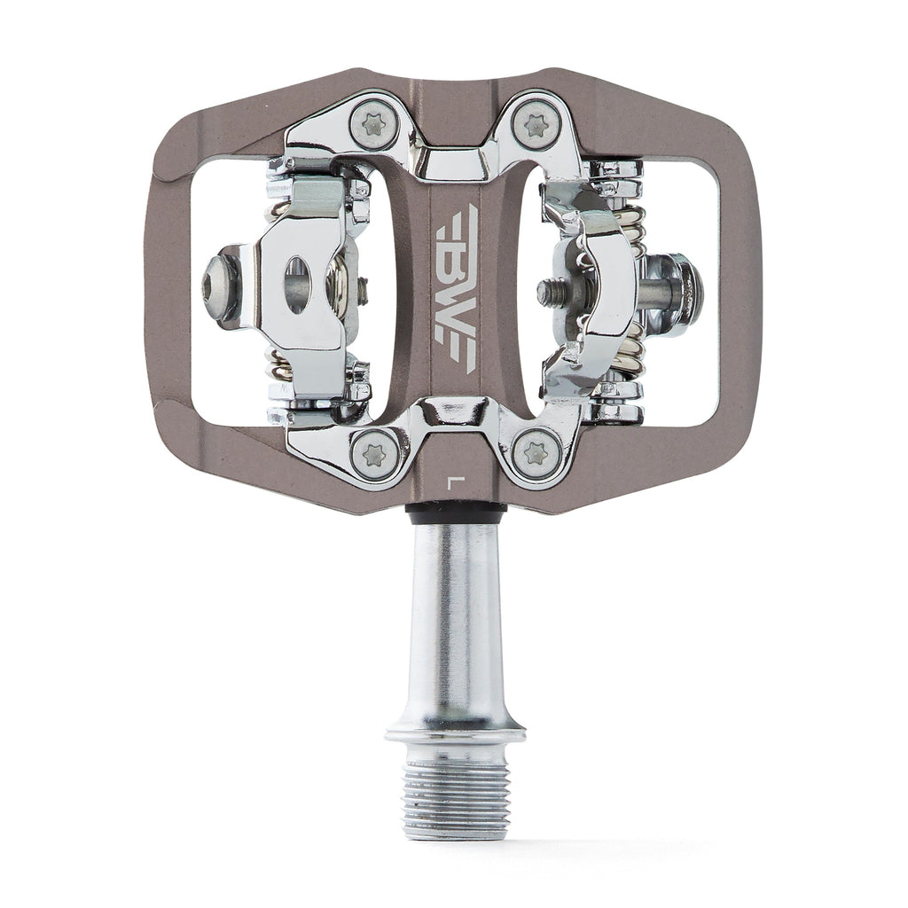 Gray clipless mountain bike pedal, top view on white background. SPD compatible bicycle pedal.