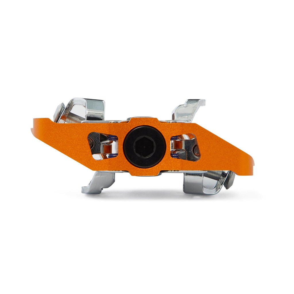 Orange clipless mountain bike pedal, side view on white background. SPD compatible bicycle pedal.