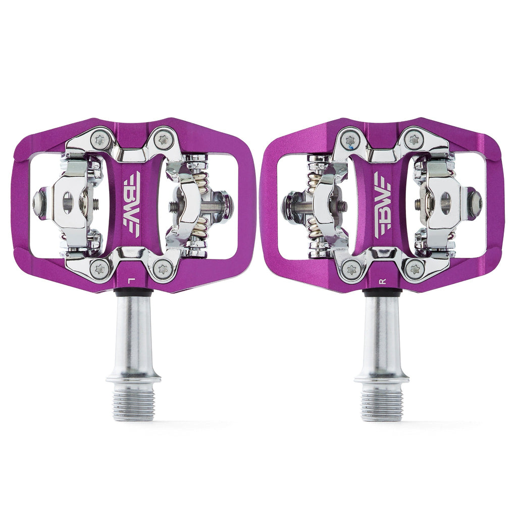 Purple clipless mountain bike pedals, top view on white background. SPD compatible bicycle pedals.