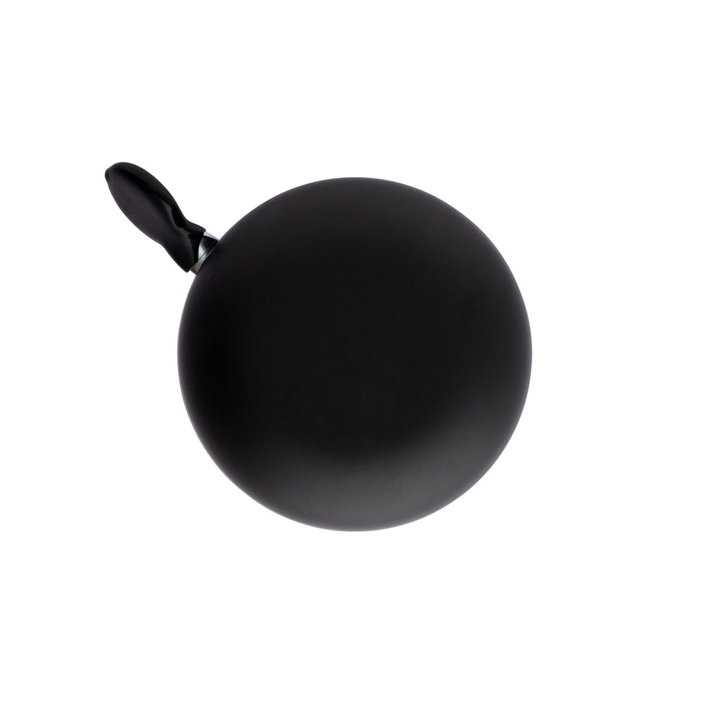 Matte black bike bell with classic ding dong sound. Top view with white background. Vintage style bike bell.
