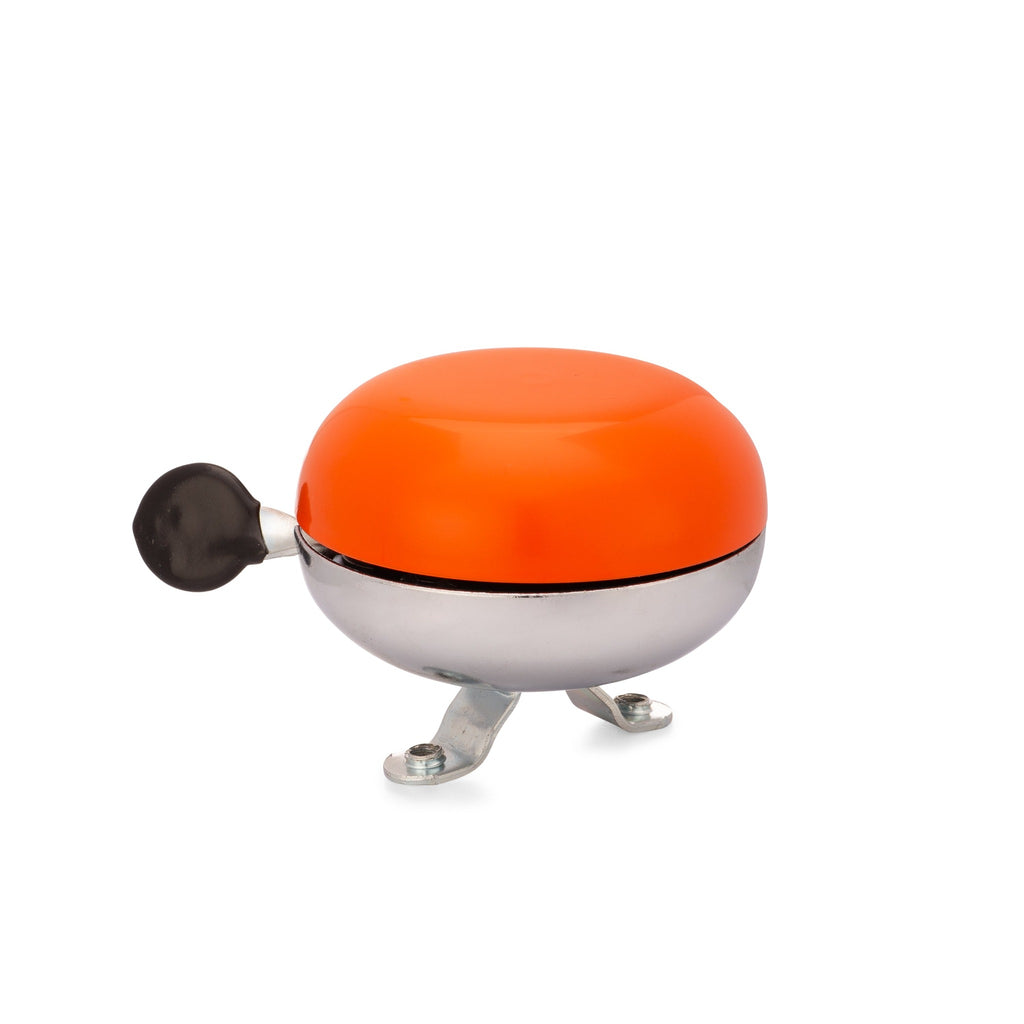 Orange bike bell with classic ding dong sound. Side view with white background. Vintage style bike bell.