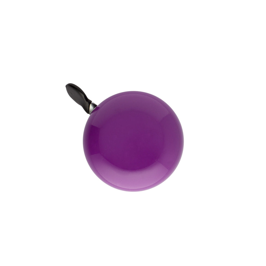 Purple bike bell with classic ding dong sound. Top view with white background. Vintage style bike bell.
