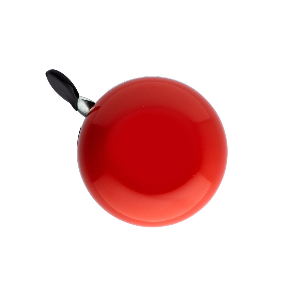 Red bike bell with classic ding dong sound. Top view with white background. Vintage style bike bell.