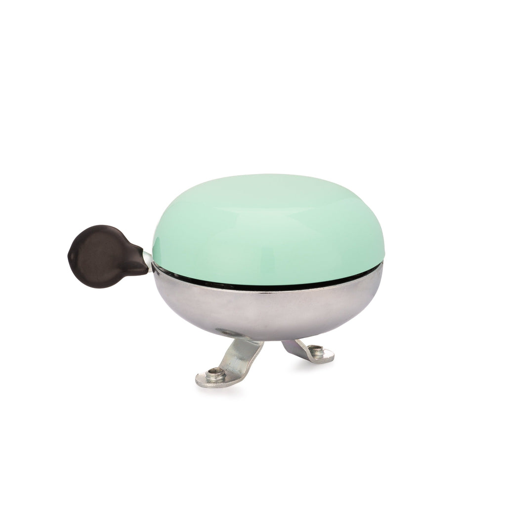 Seafoam green bike bell with classic ding dong sound. Side view with white background. Vintage style bike bell.