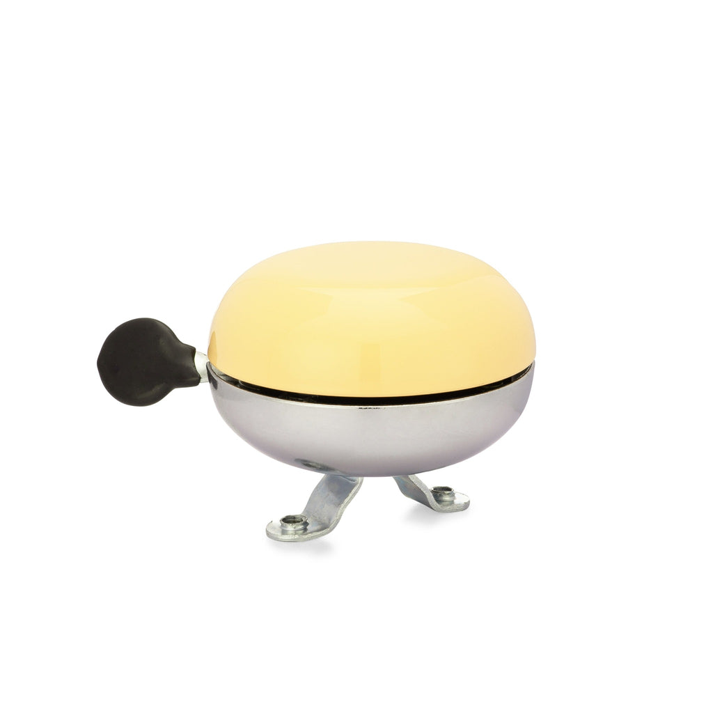 Yellow bike bell with classic ding dong sound. Side view with white background. Vintage style bike bell.
