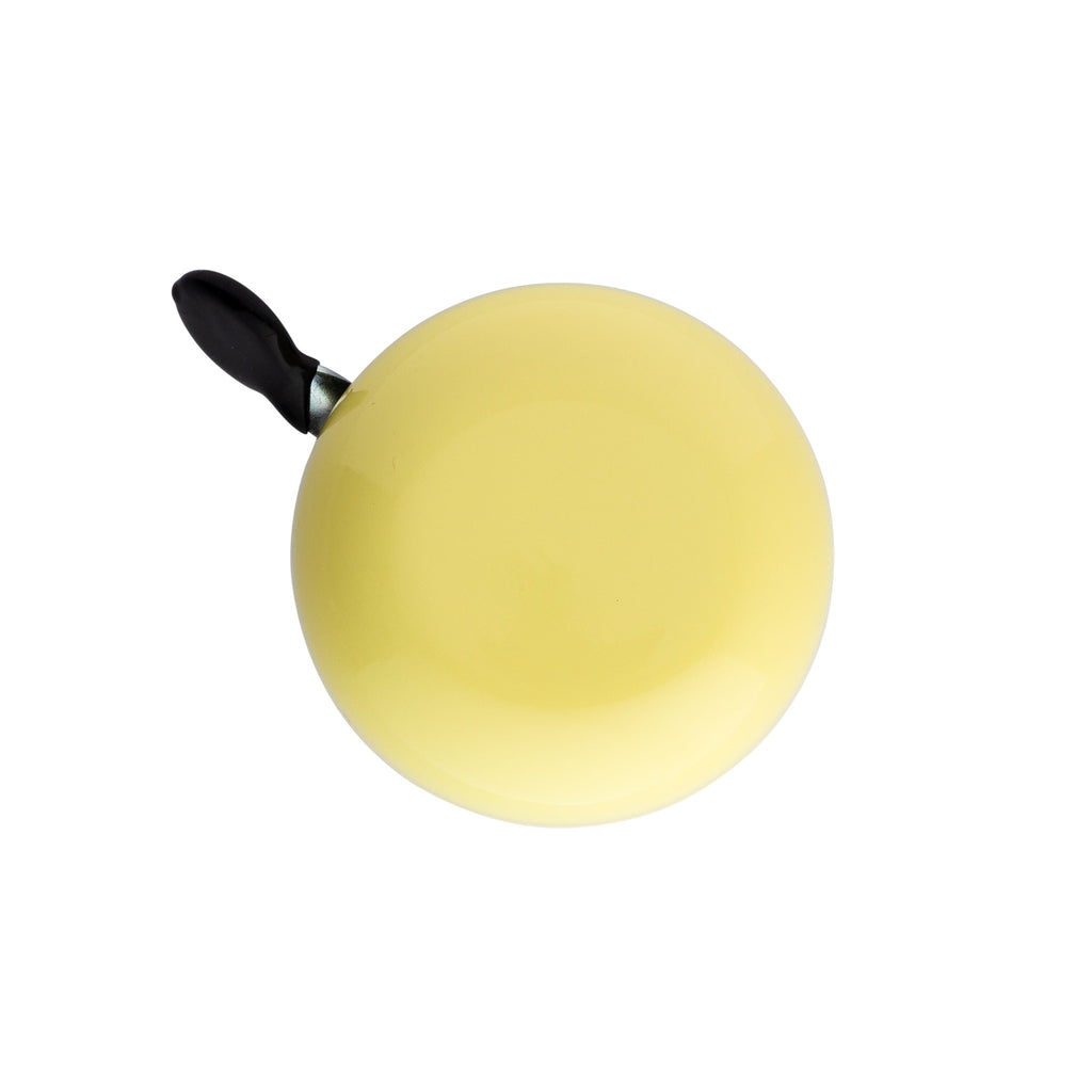 Yellow bike bell with classic ding dong sound. Top view with white background. Vintage style bike bell.