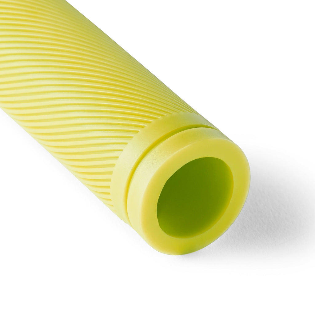 Detail shot of lime yellow bike grip for kids bikes.