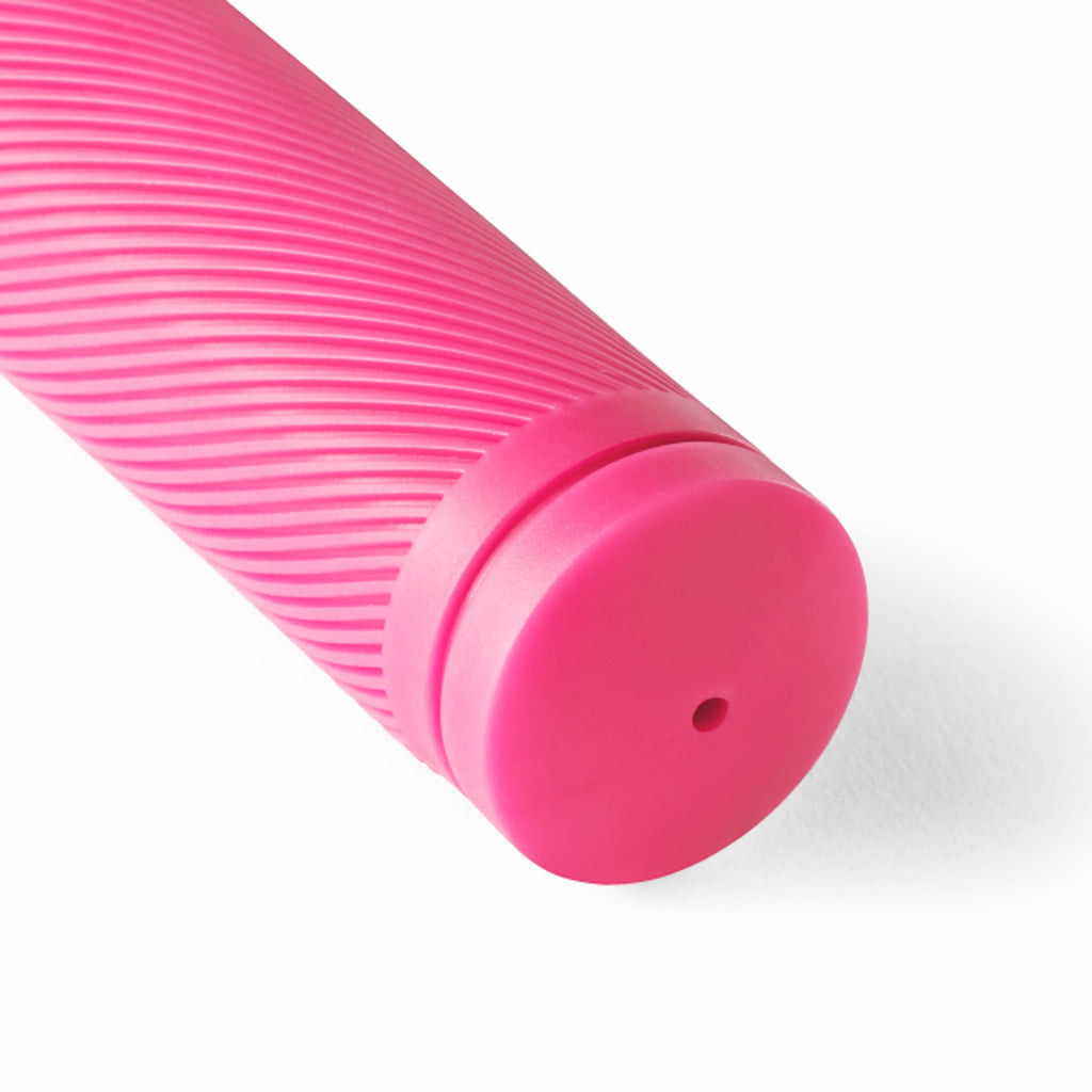 Neon pink bike grip. Close up with white background.