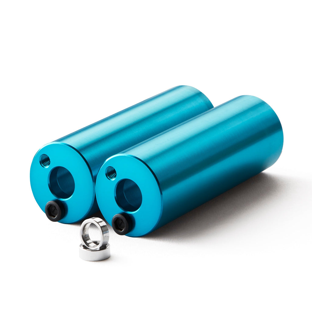 Set of light blue bmx pegs with white background.