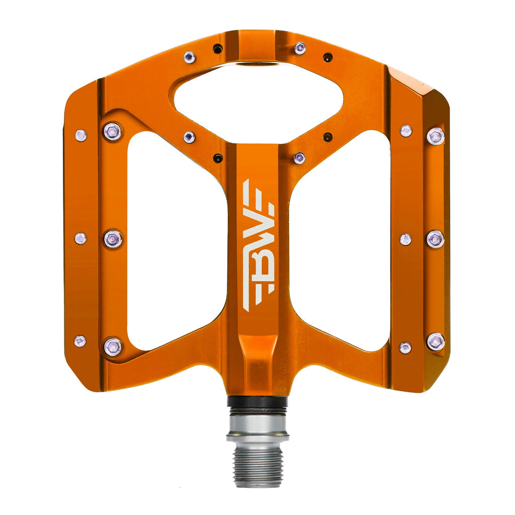 Orange mountain bike pedal on white background. Top view of mountain bike pedal.