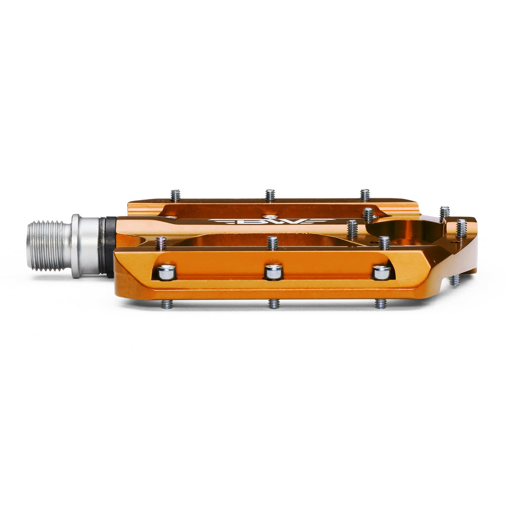 Orange mountain bike pedal on white background. Front view of mountain bike pedal.