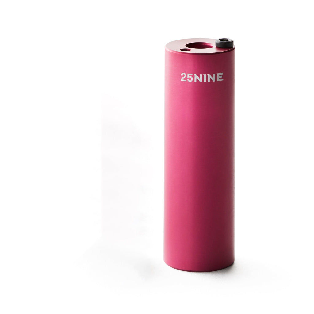 Pink bmx peg with a white background.
