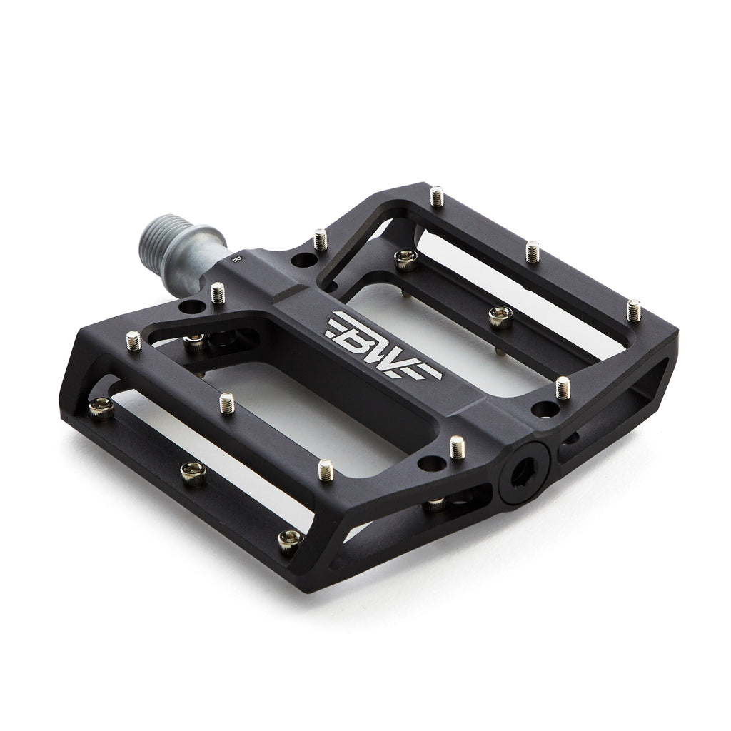 large platform mountain bike pedal with replaceable traction pins.  Mountain bike pedal is black on white background.