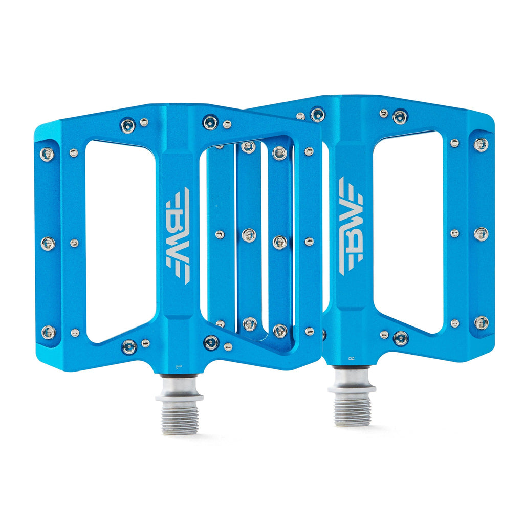 Large platform mountain bike pedals with replaceable traction pins.  Blue mountain bike pedals viewed from the top on a white background.