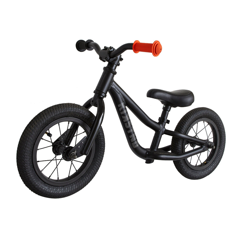 Balance bike for kids. Black balance bike for kids on white background.