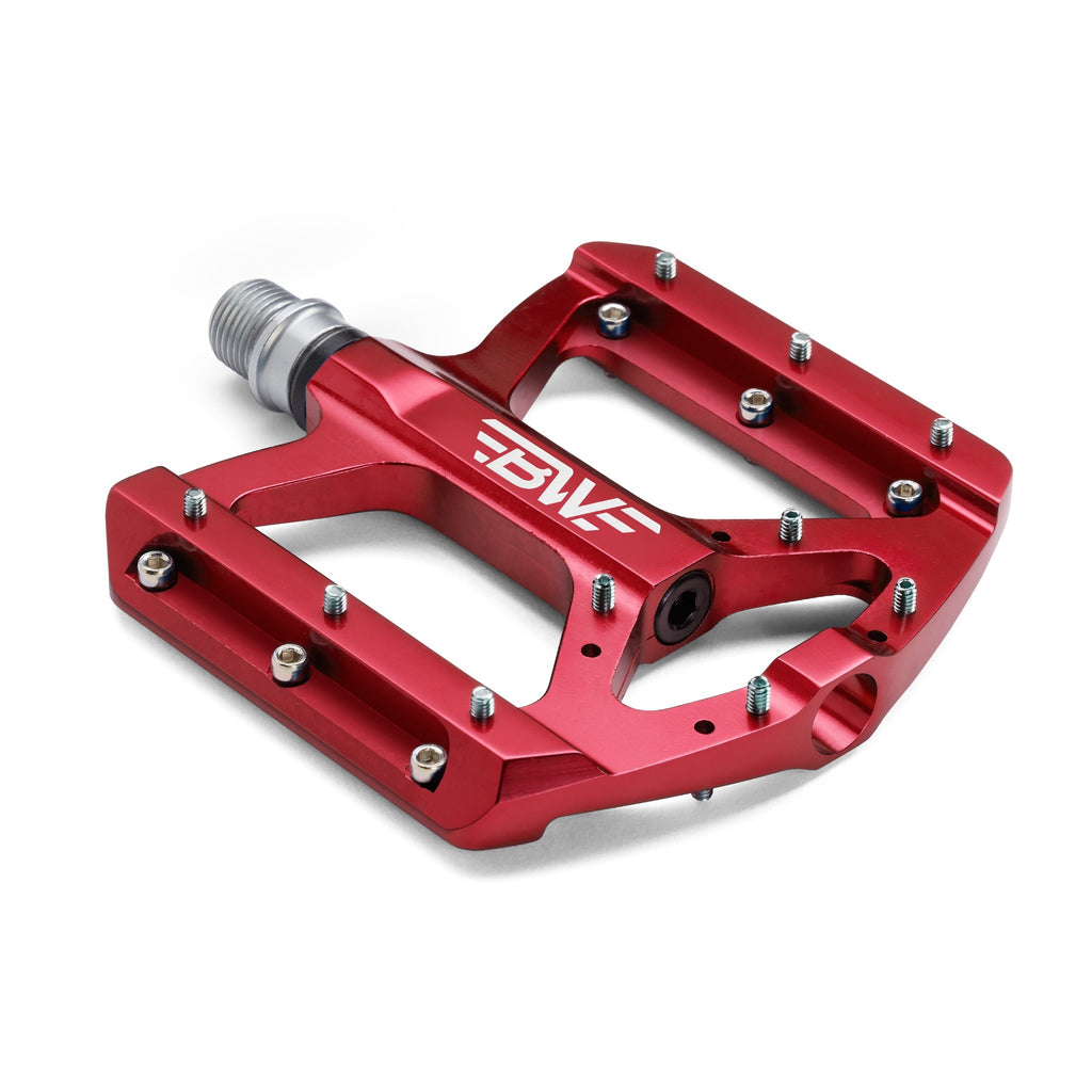 Red mountain bike pedal on white background.
