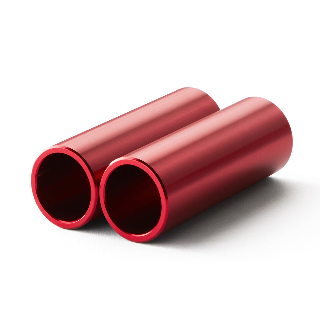 Set of red bmx pegs with white background.