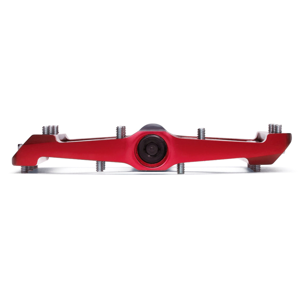 Red mountain bike pedal on white background.