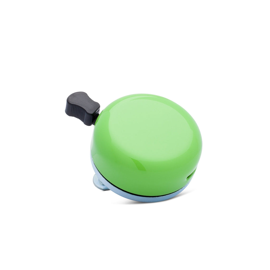 Green classic bicycle bell, corner view on white background. Vintage style bicycle bell.