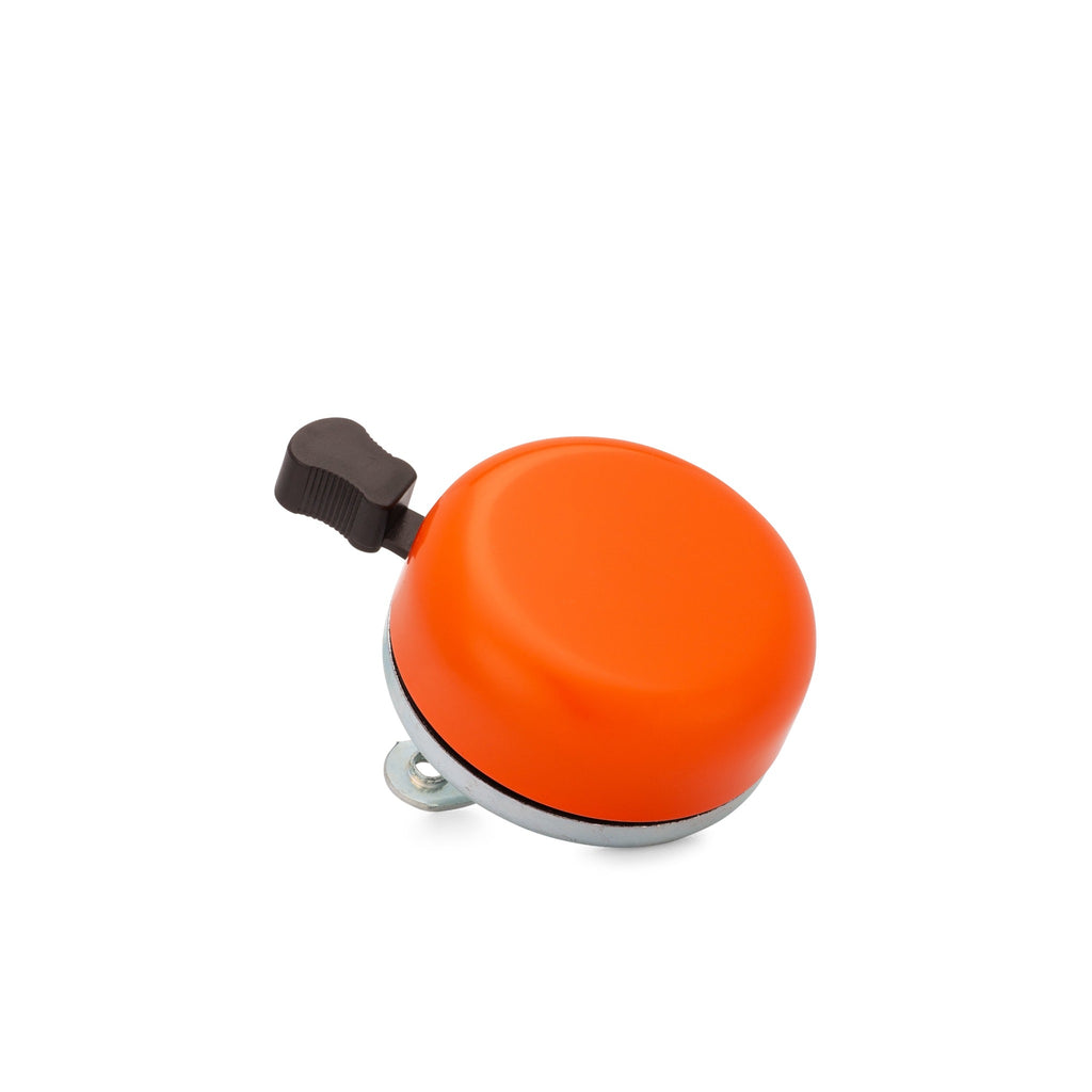 Classic bicycle bell color orange, corner view on white background. Vintage style bicycle bell.