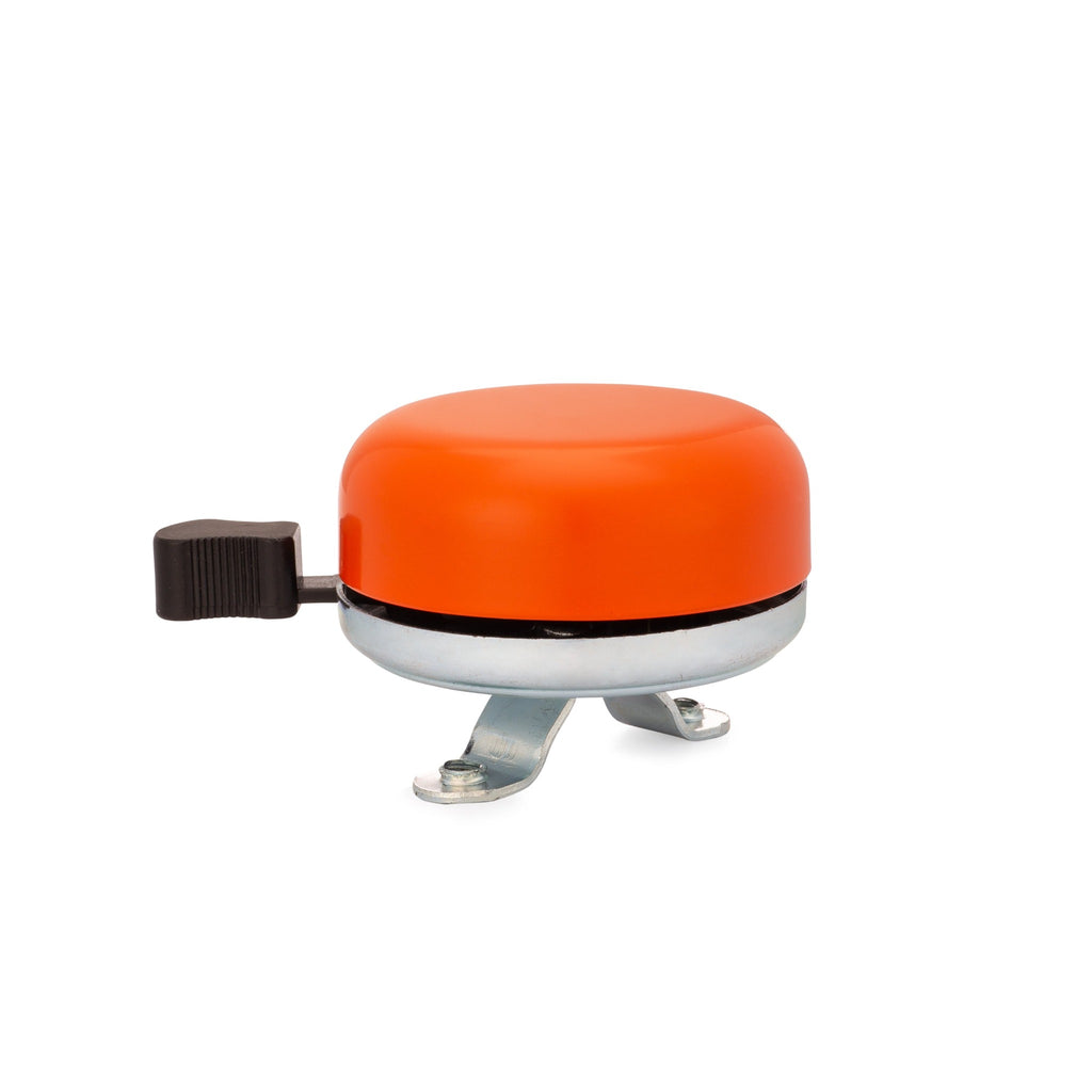 Classic bicycle bell color orange, side view on white background. Vintage style bicycle bell.