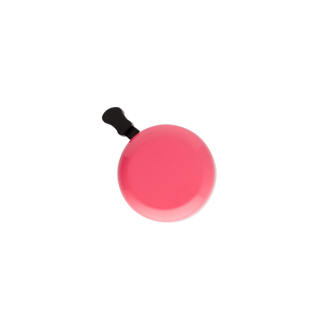 Classic bicycle bell color modern pink, top view on white background. Vintage style bicycle bell.