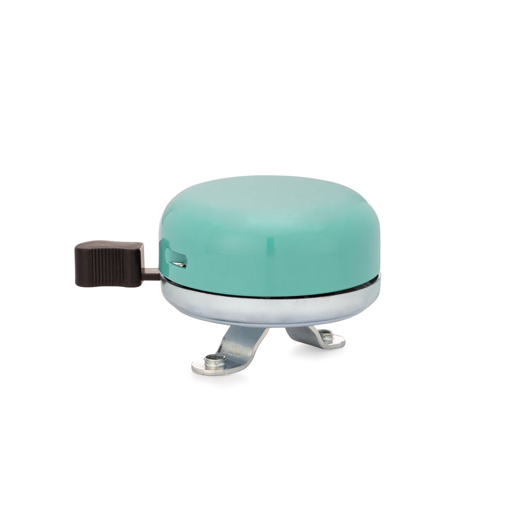 Classic bicycle bell color teal, side view on white background. Vintage style bicycle bell.