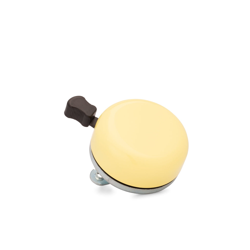 Classic bicycle bell color yellow, corner view on white background. Vintage style bicycle bell.