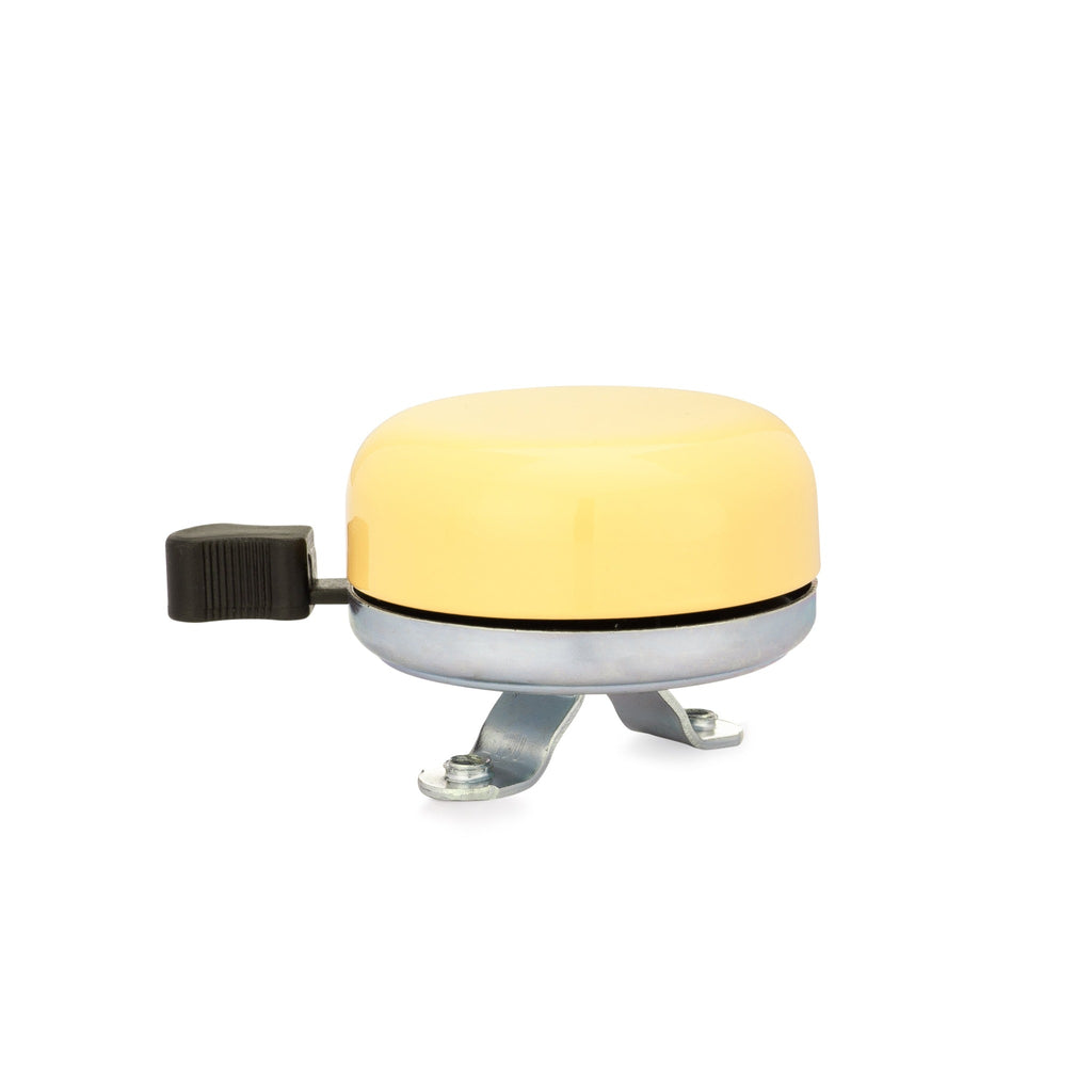 Classic bicycle bell color yellow, side view on white background. Vintage style bicycle bell.
