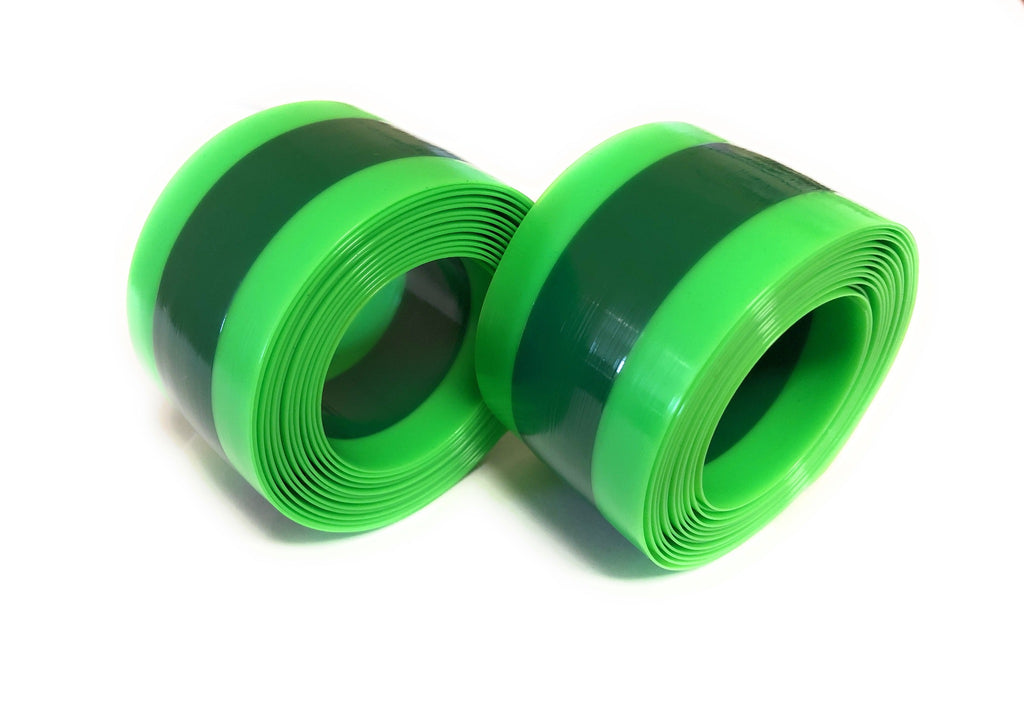 Set of puncture resistant tire liners for 27.5 to 29 inch bike tires. Green with white background.